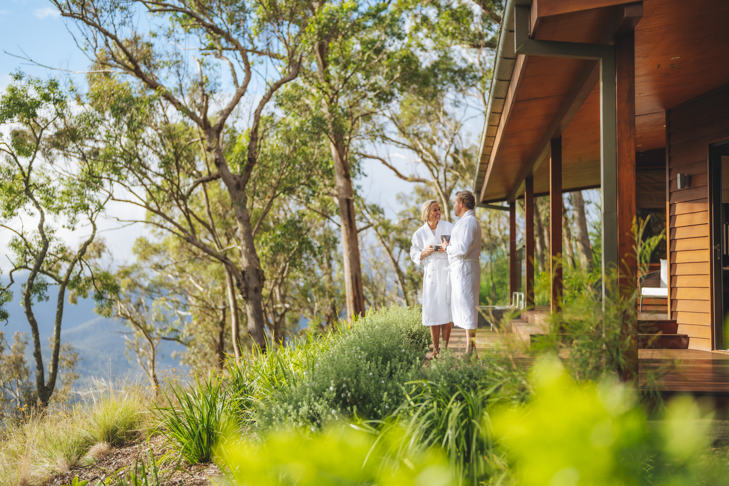Couple relaxing outside a Private Lodge at Spicers Peak Lodge Scenic Rim | 14 day road trip Queensland Couple relaxing outside a Private Lodge at Spicers Peak Lodge Scenic Rim | 14 day road trip Queensland