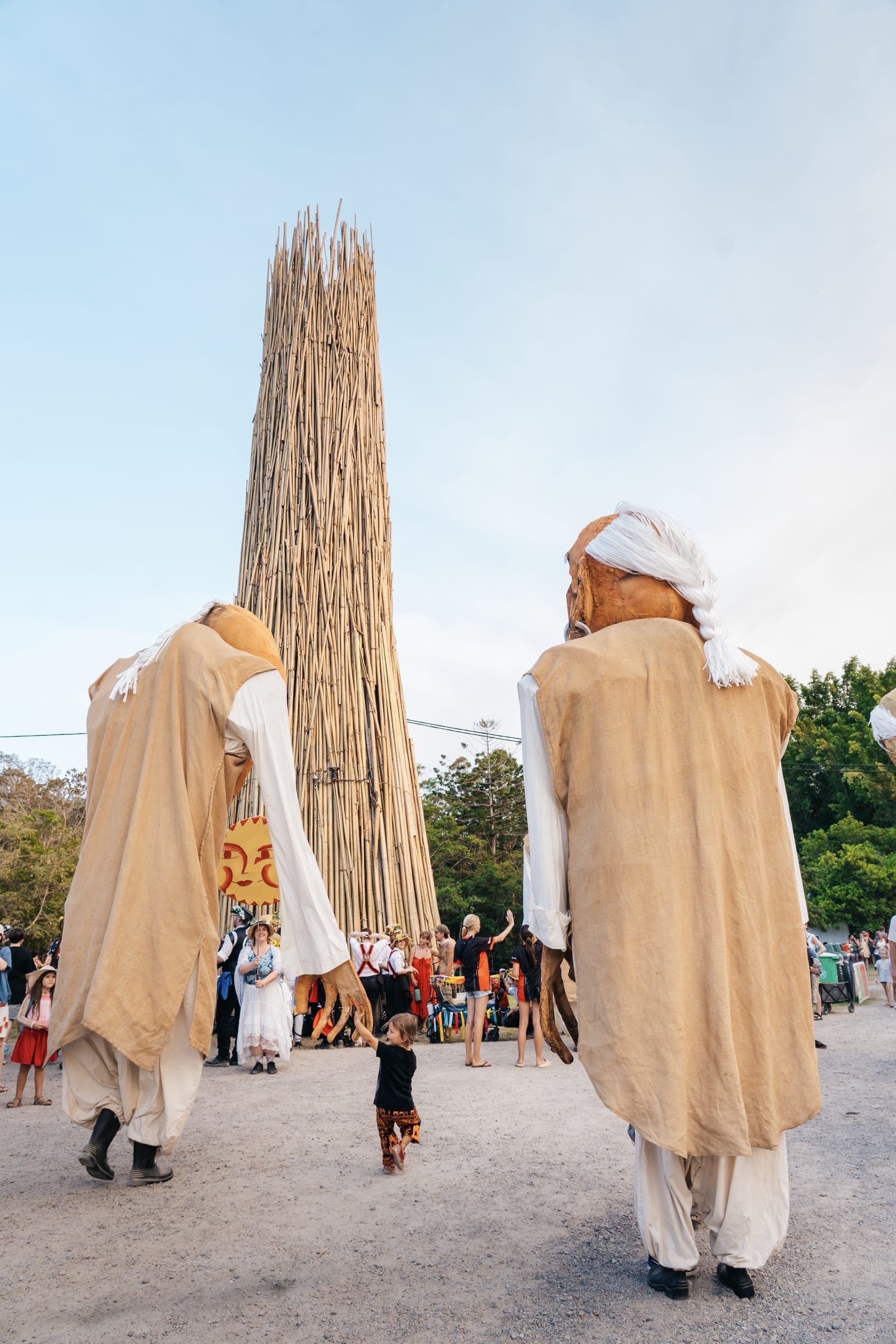 Performers on stilts at Woodford Folk Festival