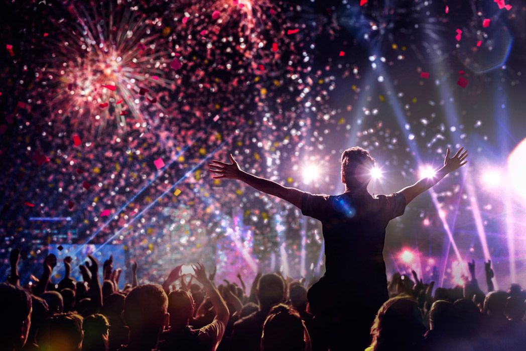 Fireworks at Festival and man on shoulders enjoying the show