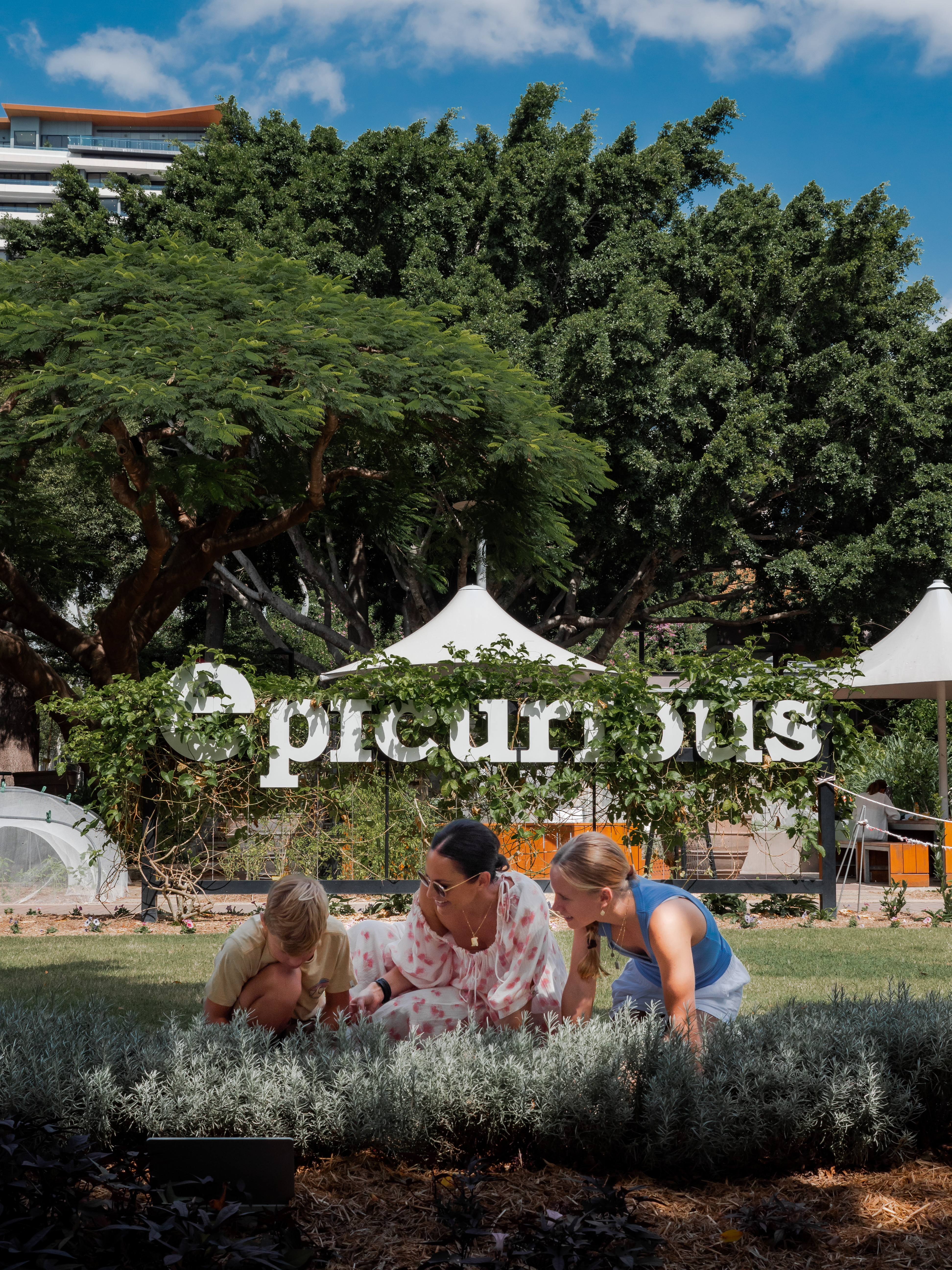 Family enjoying the Epicurious Garden, at South Bank Parklands | south bank guide for kids