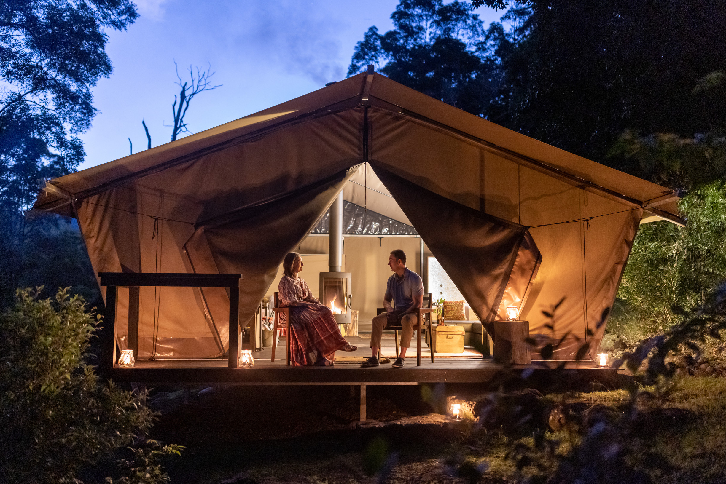 A couple relaxing in the Safari Tent at Nightfall Camp A couple relaxing in the Safari Tent at Nightfall Camp