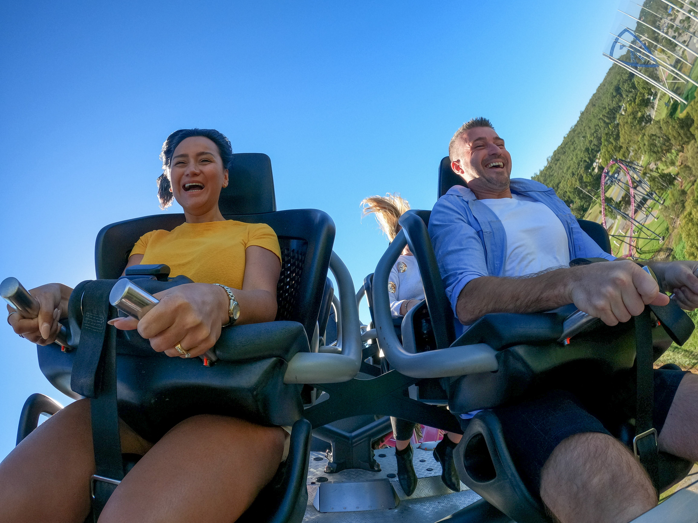 A couple on a rollercoaster at Warner Bros. Movie World on the Gold Coast A couple on a rollercoaster at Warner Bros. Movie World on the Gold Coast