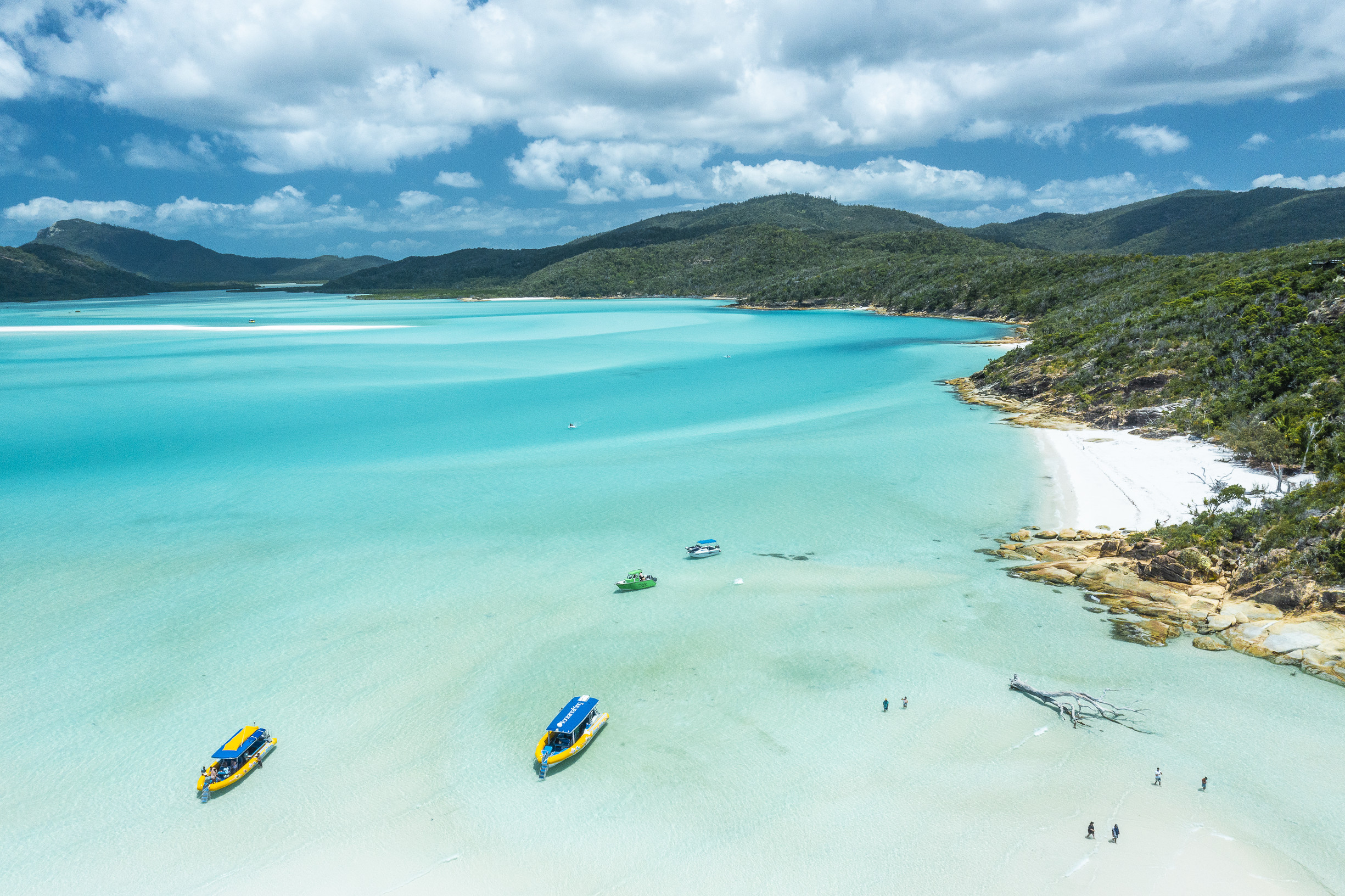 Aerial view of the Ocean Rafting boats moored off Whitehaven Beach | 14 day road trip Queensland Aerial view of the Ocean Rafting boats moored off Whitehaven Beach | 14 day road trip Queensland